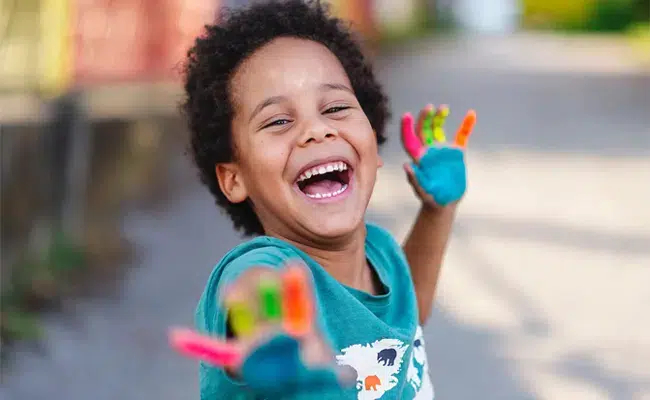 Smiling child enjoying a stress-free experience after pediatric dental appointment in Cary, NC
