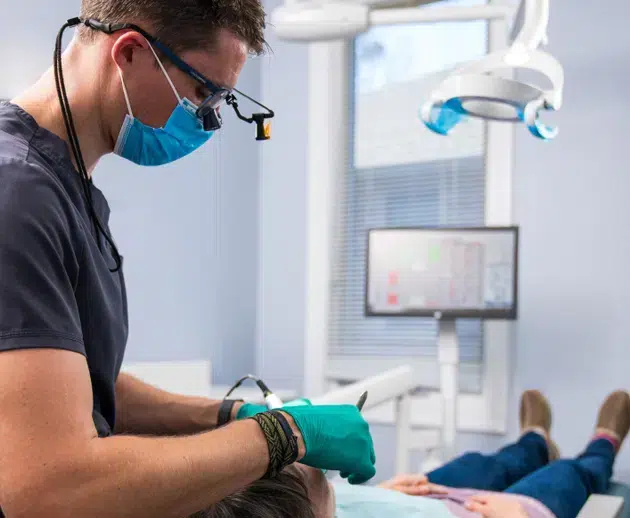 Dr. Pastoor examining a patient during a check-up at Legacy Dental