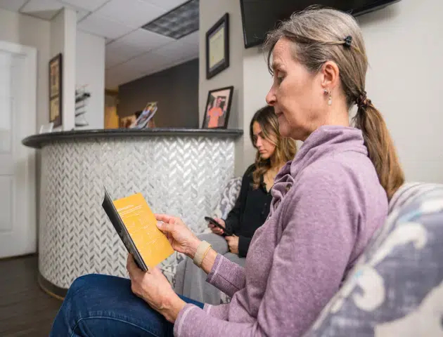 Patient reviewing dental payment options at Legacy Dental Cary